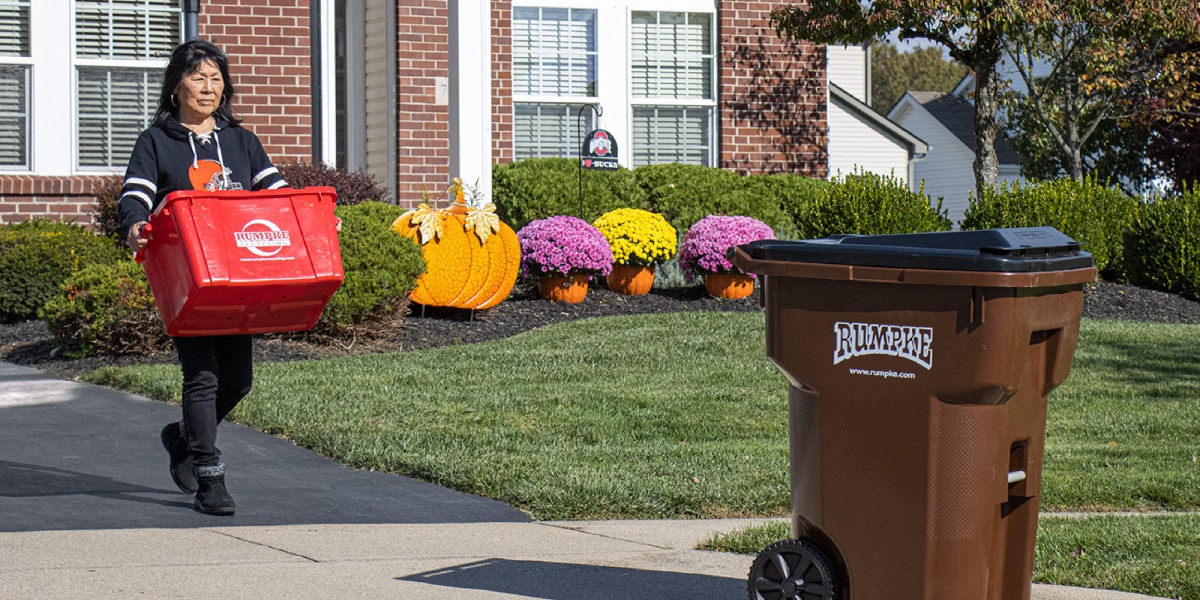 two-rumpke-recycling-bins-outside-of-house