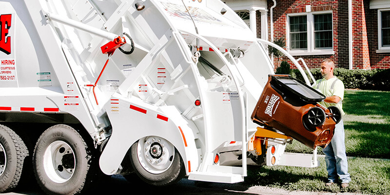 Rumpke Rear Load Truck Driver In Residential Neighborhood 1