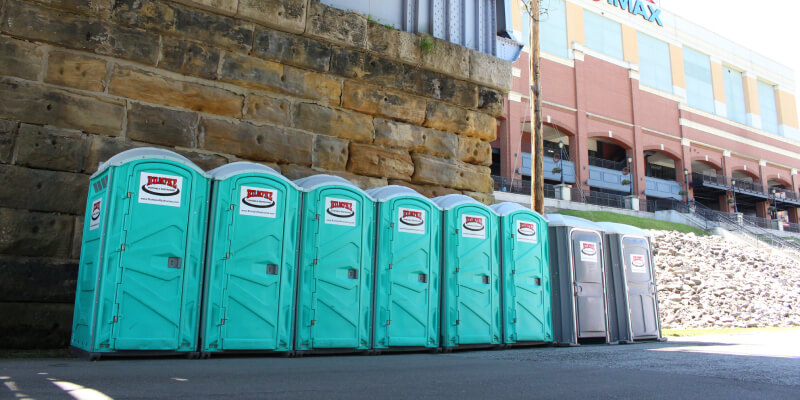 Eight Rumpke Portable Restroom Rentals Outside