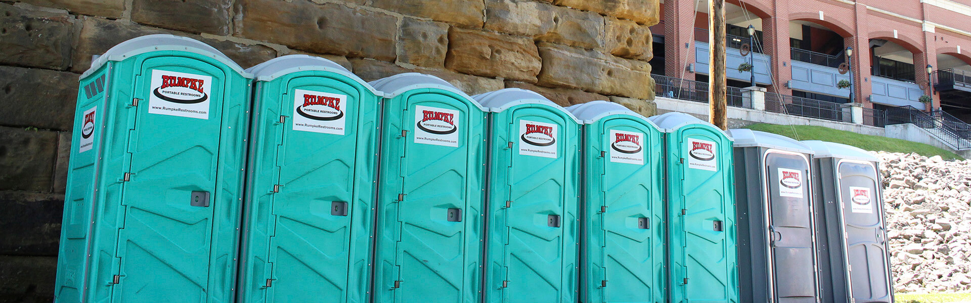 Row Of Rumpke Portable Restrooms For Waste And Recycling Event Services