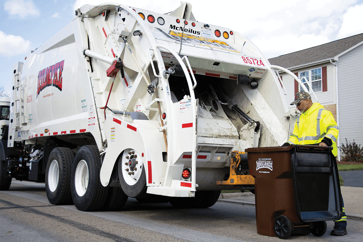 Rumpke Employee Emptying Trash Cart Into Trash Truck Ashland, KY