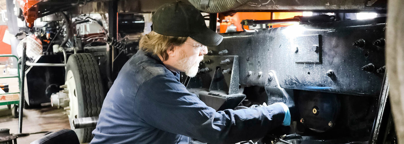 Rumpke Mechanic Repairing Heavy Equipment